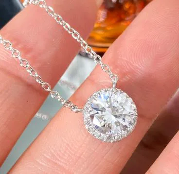 Sterling Silver Halo Pendant with Brilliant Round Center Stone & CZ Accents - Elegant Women's Jewelry