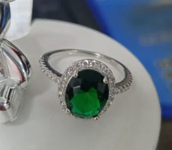 Elegant White Gold Plated Ring with Oval-Cut Green Gemstone & Cubic Zirconia Halo - Sparkling Statement Jewelry